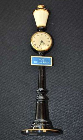 JAEGER LE COULTRE STREETLAMP CLOCK: RUE DE LA PAIX 8 DAY STREETLAMP CLOCK, MANUAL WIND MOVEMENT, SWISS MADE, CRACK IN PLASTIC LAMP, 11" TALL, BUYER ARRANGES SHIPPING, WE CAN RECOMMEND LOCAL SHIPPER.
