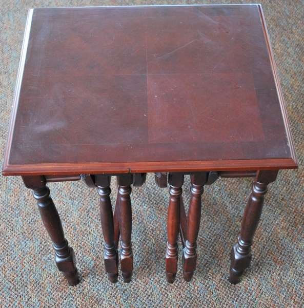 3 PIECE NESTING TABLE SET: ONE MAIN SQUARE TABLE WITH TWO CIRCULAR DROP LEAF FOLDING TABLES THAT SLIDE NEATLY UNDERNEATH, NICELY CRAFTED, SLIGHT DAMAGE TO TABL TOP VENEER, MAIN TABLE SITS 21.5" HIGH, TABLE TOP: 20.25" x 17.75"