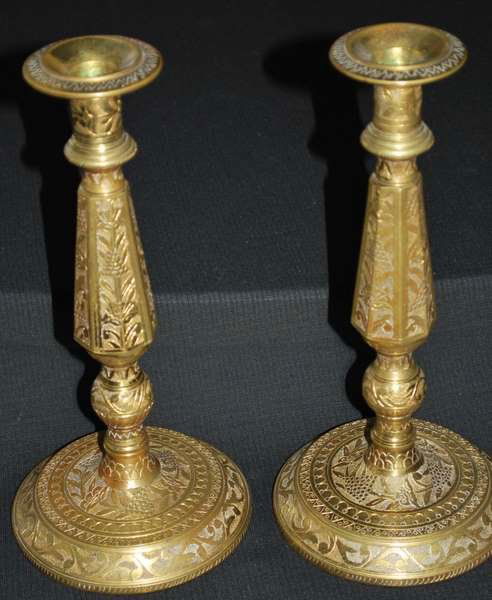 PAIR OF ANTIQUE BRONZE CANDLESTICKS: HEAVY PIECES, BRASS PAINT OVER BRONZE, ORNATE CARVED DESIGNS, POSSIBLY TURKISH OR RUSSIAN, EACH SIT 10.75" HIGH, BUYER ARRANGES SHIPPING, WE CAN RECOMMEND LOCAL SHIPPING.