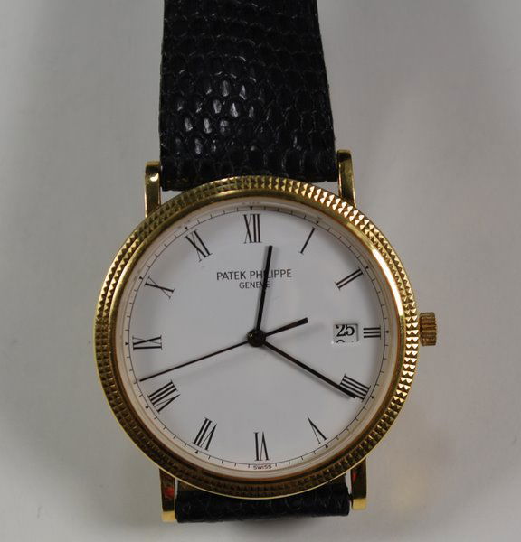 MENS 18KT Y.G. PATEK PHILIPPE CALATRAVA: QUARTZ REF #3944 WITH 18KT PATEK BUCKLE AND STRAP PLUS SHIPPING