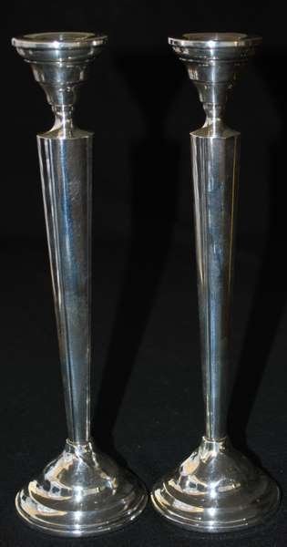 PAIR OF REICHARDT STERLING CANDLESTICKS: 10" WEIGHTED STERLING CANDLESTICKS BY OTTO REICHARDT, NY; CIRCA 1925 - 1940, CEMENT FILLED, ALL MARKS - "679" ON BOTTOM PLUS SHIPPING