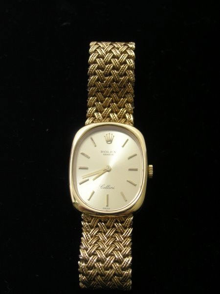 LADIES 18KT Y.G. ROLEX CELLINI: MANUAL WIND TWT 55.7 GRAMS JUST SHY OF 7" LONG WITH BOX AND PAERS CIRCA 1983 PLUS SHIPPING