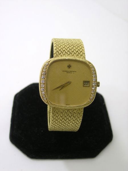MENS 18KT Y.G. VACHERON & CONSTANTIN DIAMOND WATCH: CIRCA 1980'S LARGE CUSHION HEAD GOLD TEXTURED DIAL HAS SOME BLACK SPOTS AFTERMARKET DIAMOND BEZEL APPROX G COLOR VS QJUALITY DIAMONDS .50CT HAS DATE TWT 114.5 GRAMS CASE 38MM WITH ORIGINAL CROWN FULL