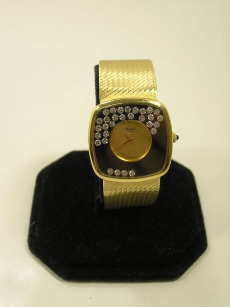 MENS 18KT Y.G. CHOPARD HAPPY DIAMOND WATCH: CIRCA 1970'S MANUAL WIND SET WITH APPROX. 2.00CT F COLOR VVS QUALITY FLOATING DIAMONDS TWT 96.5 GRAMS BAND 8" LONG CASE BACK HAS SMALL DENT AND BAND HAS SMALL CREASE CASE APPROX. 35MM WITH CROWN PLUS