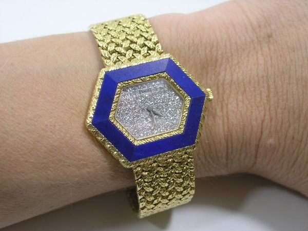 LADIES 18KT Y.G. PIAGET DIAMOND WATCH: CIRCA 1980'S MANUAL WIND FACXTORY DIAMOND DIAL OCTAGON CASE WITH BLUE LAPIS BEZEL TWT 90.4 GRAMS CASE 36MM WIDE WITH CROWN BAND 7" LONG PLUS SHIPPING