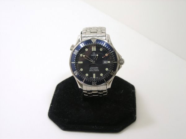 OMEGA JAMES BOND BLUE WAVE DIAL WATCH: EXCELLENT CONDITION. BOX AND PAPERS. QUARTZ OMEGA MOVEMENT. PLUS SHIPPING