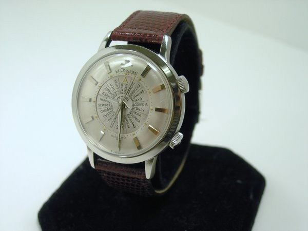 MENS S/S JAEGER LECOULTRE WORLD TIME ALARM: RARE NEW OLD STOCK AUTOMATIC BUMPER MOVEMENT NEVER WORN 37MM CASE NEW LIZARD STRAP BUYER ARRANGES SHIPPING