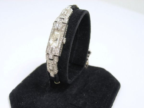 PLATINUM ART DECO DIAMOND WATCH: CIRCA 1930'S SET WITH APPROX. 1.25CT EUROPEAN CUT H-I COLOR SI QUALITY DIAMONDS TWT 15.2 GRAMS WITH NYLON STRAP APPROX. 2.25" LONG X .33" WIDE DIAL SIGNED BELVIL 17 JEWEL INCABLOC MOVEMENT