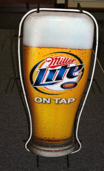 NEON MILLER LITE SIGN: NEON BEER SIGN ADVERTISING MILLER LITE ON TAP, 40" TALL, IN WORKING CONDITION.