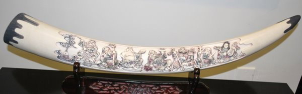 LARGE IVORY 19th CENTURY TUSK CARVING: BEAUTIFULLY DETAILED CARVING OF SEVEN ORIENTAL MEN ON A IVORY TUSK, WITH WOOD STAND, 30 " LONG,128 OZ. (not for export )