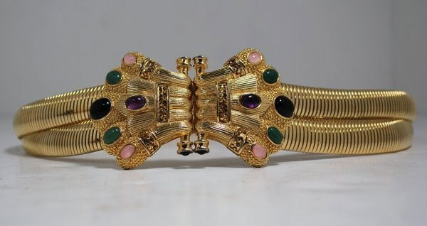 JUDITH LEIBER JEWELED SNAKE BELT: IN GOLD TONE WITH JEWELS ON THE BUCKLE, 33 " AT MAX STRETCH, CIRCA 1980's