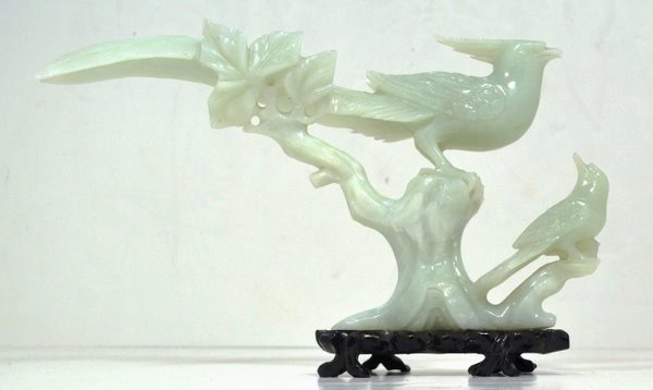 JADE CARVING, BIRDS: JADE CARVING OF BIRDS ON A BRANCH 12" LONG AND 7" HIGH ON A WOOD BASE