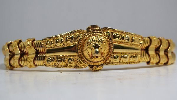 JUDITH LEIBER SNAKE BELT: IN GOLD TONE, 31 " AT MAX STRETCH, CIRCA 1980's