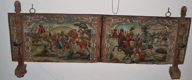 MEDIEVAL BATTLE PAINTING: MEDIEVAL BATTLE PAINTING ON A LARGE CARVED WOOD PLAQUE, 2 - 500 YEARS OLD, 49 X 14 "