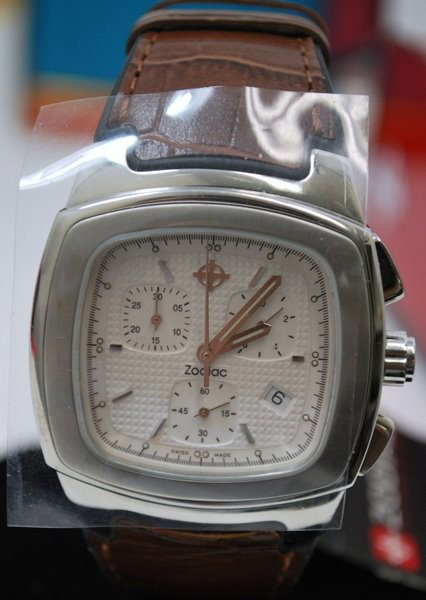 ZODIAC S/S CHRONOGRAPH: NEW IN BOX, RECTANGULAR WATCH WITH SWISS QUARTZ MVT. ON BROWN STRAP COMES WITH PAPERS.