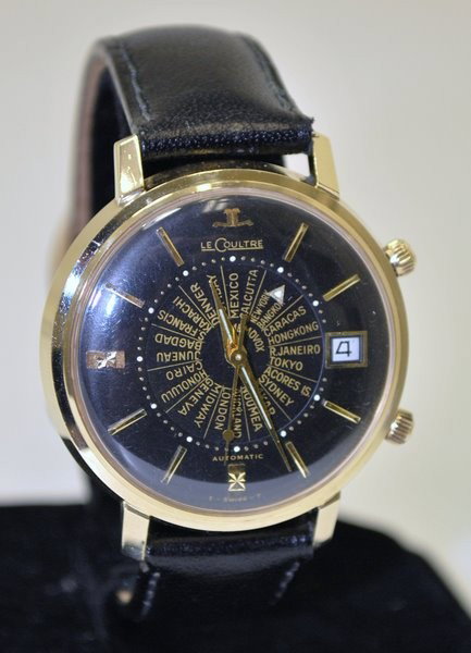 JAEGER LECOULTRE 14KT WORLDTIME: 1950S MEMOVOX , NEW OLD STOCK, BLACK + GOLD DIAL, BUMPER ALARM MVT, FABULOUS COLLECTOR PIECE, HAS DATE FEATURE. WATCH IS A 10/10