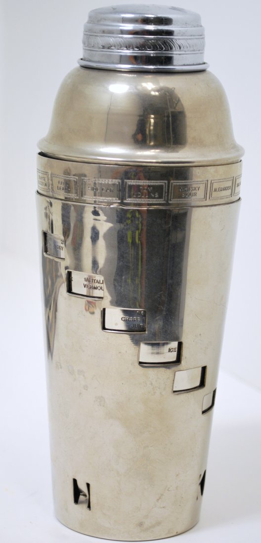 1950S VINTAGE STEEL DRINK MIXER: VINTAGE DRINK MIXER, INNER CUP ROTATES TO SHOW RECIPIES FOR DIFFERENT DRINKS. CIRCA 1950S