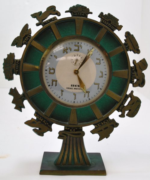 IDOX ISRAELI CLOCK: GREEN DESK CLOCK DIAL FEATURES ISRAELI CHARACTERS. CLOCK IS MARKED ON THE DIAL AND ON THE BACK OF THE STAND "ISRAELI WATCH CO."