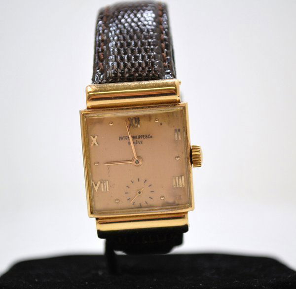 MENS PATEK PHILIPPE 18KT R.G. W/ BOX AND PAPERS: VERY RARE RECTANGULAR "BOMBAY" 18 JEWEL MVT CIRCA 1940'S COMES WITH BOX & PAPERS. EXCELLENT CONDITION, DIAL HAS SOME AGE. REF 1438