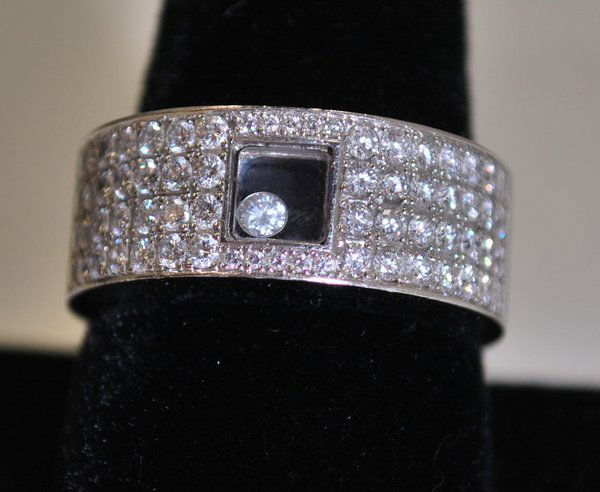 18KT W.G. CHOPARD HAPPY DIAMOND RING: SET WITH 1.58CT FACTORY DIAMONDS PLUS .05CT FLOATING DIAMOND SIGNED AND NUMBERED COMES WITH CHOPARD PAPERS TWT 17.8 GRAMS SIZE 9.50