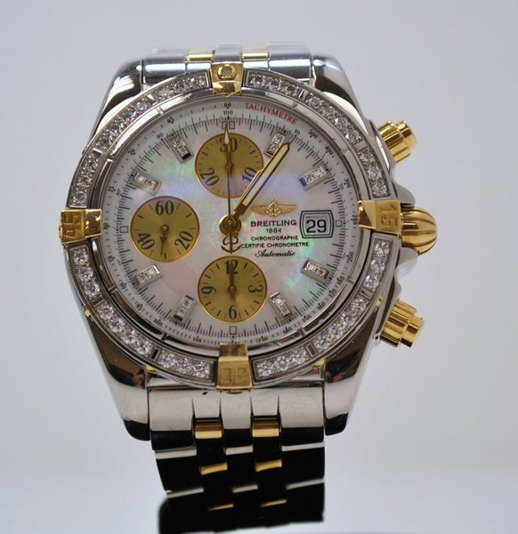 BREITLING EVOLUTION 18KT & S/S: DIAMOND BEZEL AND MOTHER OF PEARL DIAL. STAINLESS STEEL BAND OPEN PAPERS, INCLUDES BOX AND BOOKLETS.