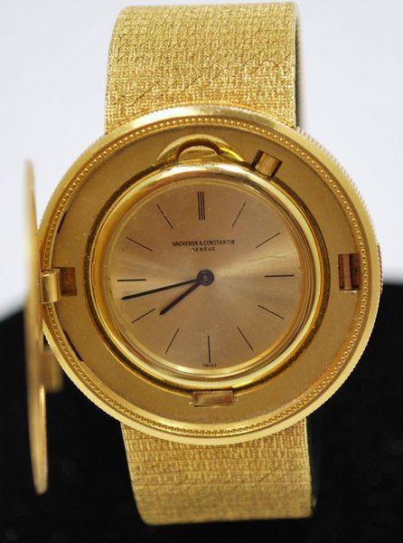18KT Y.G. VACHERON&CONSTANTIN $20 COIN WATCH: CIRCA 1970'S MANUAL WIND POP UP TOP COMES ON ASSOCIATED 18KT BAND TWT 82.4 GRAMS BRACELET JUST OVER 7.25" LONG