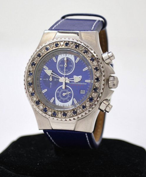 UNISEX S/S TECHNOMARINE CHRONOGRAPH: NEW HAS SAPPHIRE AND DIAMOND ROTATING BEZEL COMES ON ELECTRIC BLUE STRAP AND DIAL 2 REGISTER QUARTZ MOVEMENT HAS CASE AND BOOKLET AND PAPER