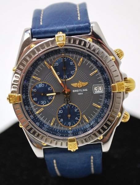 BREITLING 18KT/SS CHRONOGRAPH: TWO TONE BREITLING 3 REG CHRONO ON BLUE LEATHER STRAP, WITH BLUE AND GREY DIAL. INCLUDES BOX AND PAPERS.