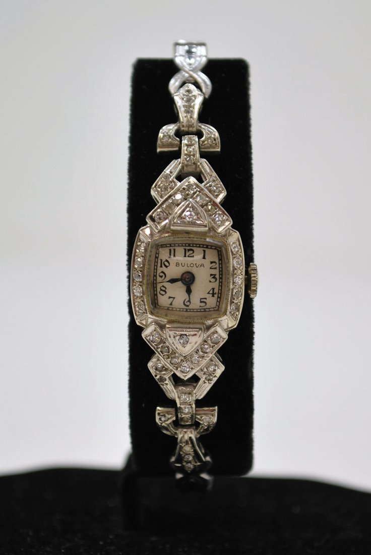 14KT BULOVA LADIES DIAMOND WATCH: 14KT W.G. WITH 1 CT DIAMONDS. CIRCA 1950S COMES WITH ORIGINAL BOX.