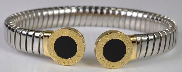 18KT/SS BVLGARI SNAKE BANGLE: HAS BLACK ONYX INSERTS SIGNED AND NUMBERED ON INNER LINKS WILL FIT UP TO 6.50' WRIST