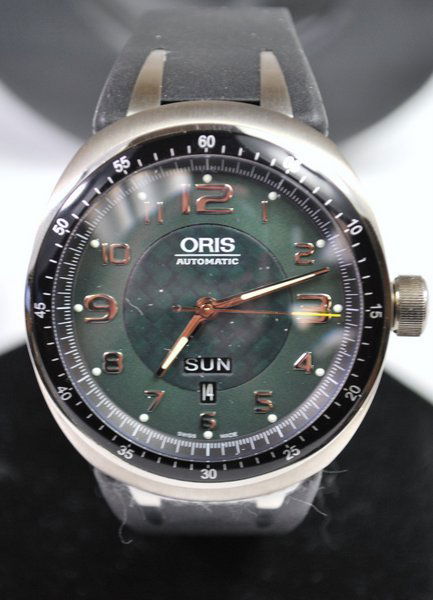 MENS TITANIUM ORIS DAYDATE NEW B&P: GREEN DIAL LARGE DAY AND DATE EXHIBITION BACK RUBBER DEPLOYMENT STRAP NEW WITH BOX AND PAPERS