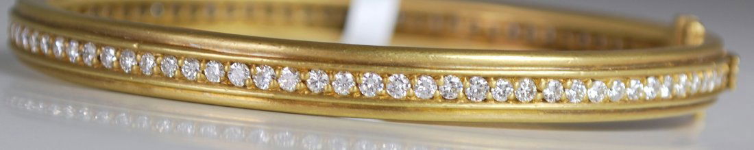 18KT Y.G. JUDITH RIPKA DIAMOND ETERNITY BANGLE 3.00CT: ETERNITY BRACELET SET WITH APPROX. 3.00CT G-H COLOR VS QUALITY DIAMONDS TWT 34.7 GRAMS WILL FIR UP TO APPROX. 6" WRIST