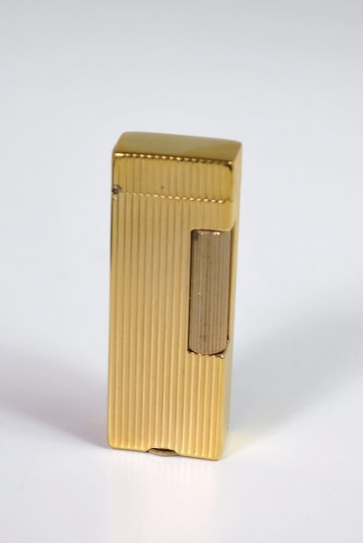 DUNHILL LIGHTER: COMES WITH DUNHILL BOX AND POUCH, GOLD PLATED, NEVER USED.