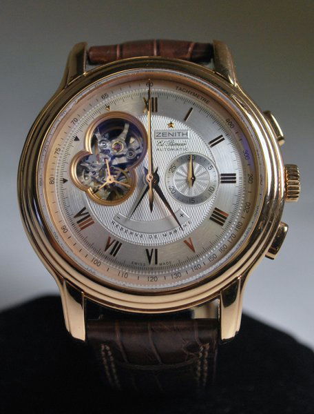 18KT P.G. ZENITH CHRONOMASTER XXT B&P: AUTOMATIC 45MM CASE COMES WITH ORINIAL BROWN STAP AND 18KT BUCKLE HAS BOX AND BOOKS OPEN HEART DIAL