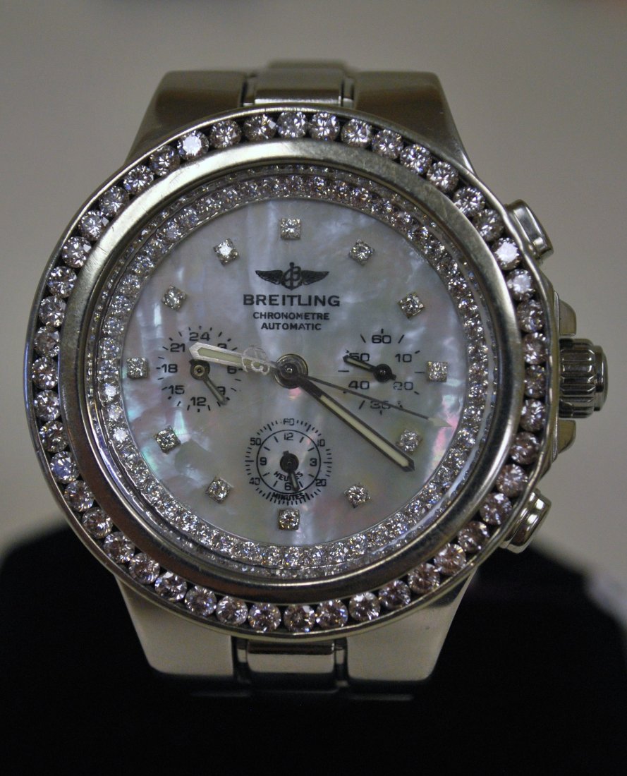 MENS S/S BREITLING DIAMOND HERCULES: SET WITH AFTERMARKET DIAMOND DIAL AND BEZEL APPROX. 5.00CT H-I COLOR SI QUALITY DIAMONDS ON BEZEL AND DIAL 3 REGISTER AUTOMATIC MOTHER OF PEARL DIAL FULL SIZE BAND NOTE DIAL HAS SMALL HAIRLINE AND CAN