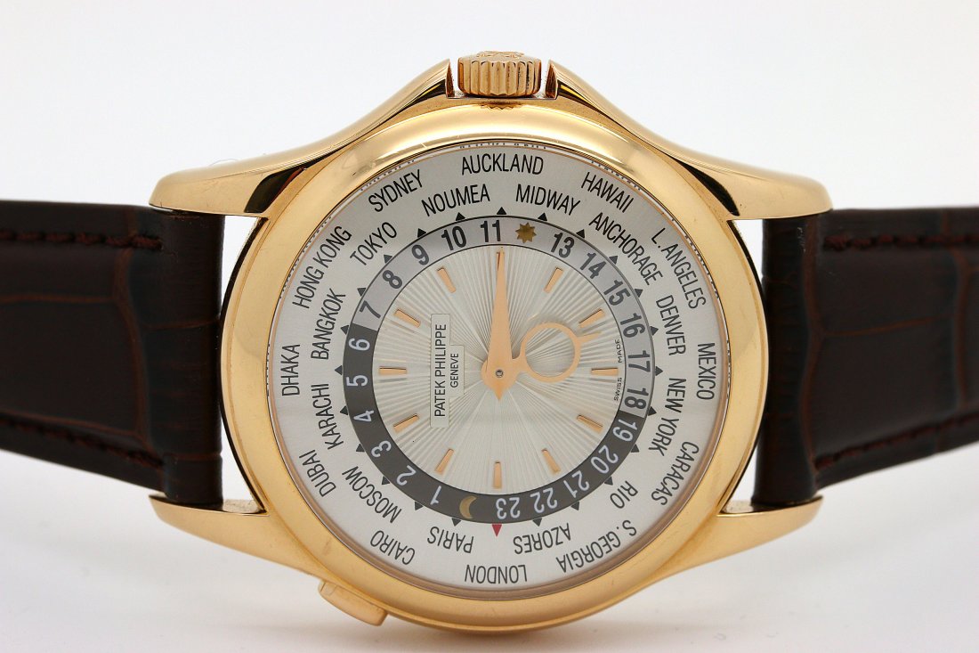 18KT P.G. PATEK PHILIPPE WORLD TIME REF #5130R: LARGE SIZE PATEK PHILIPPE WORLD TIME PINK GOLD WITH DEPLOYMENT BUCKLE 42MM CASE EXHIBITION BACK BROWN ALLIGATOR STRAP LIST $47.000.00 MOVEMENT CAL 240HU AS NEW NEVER WORN