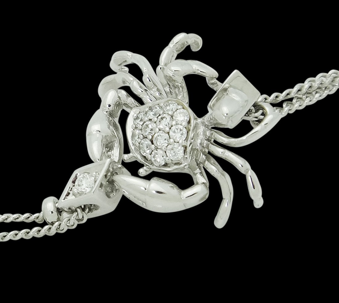 Stephen Webster Jewels Verne 18k White Gold & 0.16: Brand: Stephen Webster, Jewels Verne Collection Metal: 18K White Gold Stones & Gems:16 Diamonds, 0.16 TCW Total Item Weight:6.1 grams Size:6.5 inches Crab Measurements: 11 x 15mm