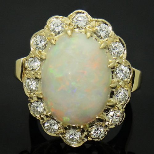 14K YELLOW GOLD 1.40CT DIAMOND VS G DIAMOND & OPAL RING: approx. 1.40 carats EXCELLENT VS CLARITY G COLOR Gem: Opal 16.40 x 12.40mm Total Item Weight: 11.7g Size: 6.25 Front design Measurements: 24.37 x 19.02mm Hallmarks, Stamps or Metal Test: 14k