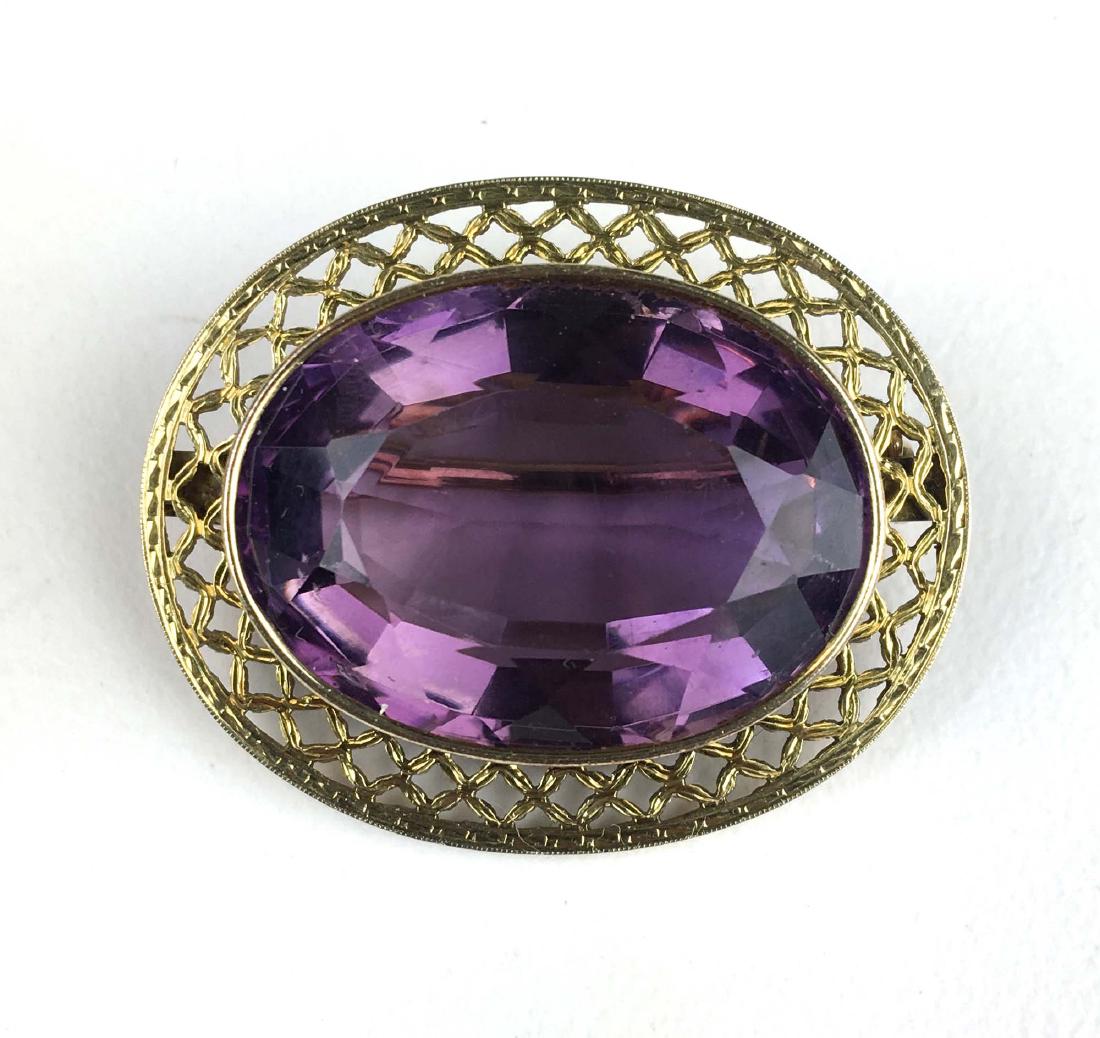 14k yellow gold amethyst oval cut brooch. (1 of 2)