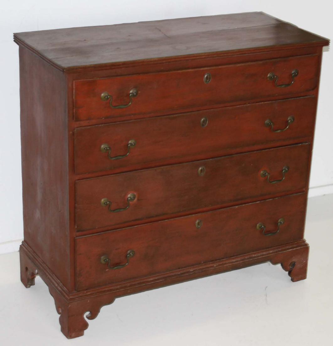 Chippendale birch chest: in old red finish 38"w with graduated drawers, and bracket base Some lip damage and replaced hardware.