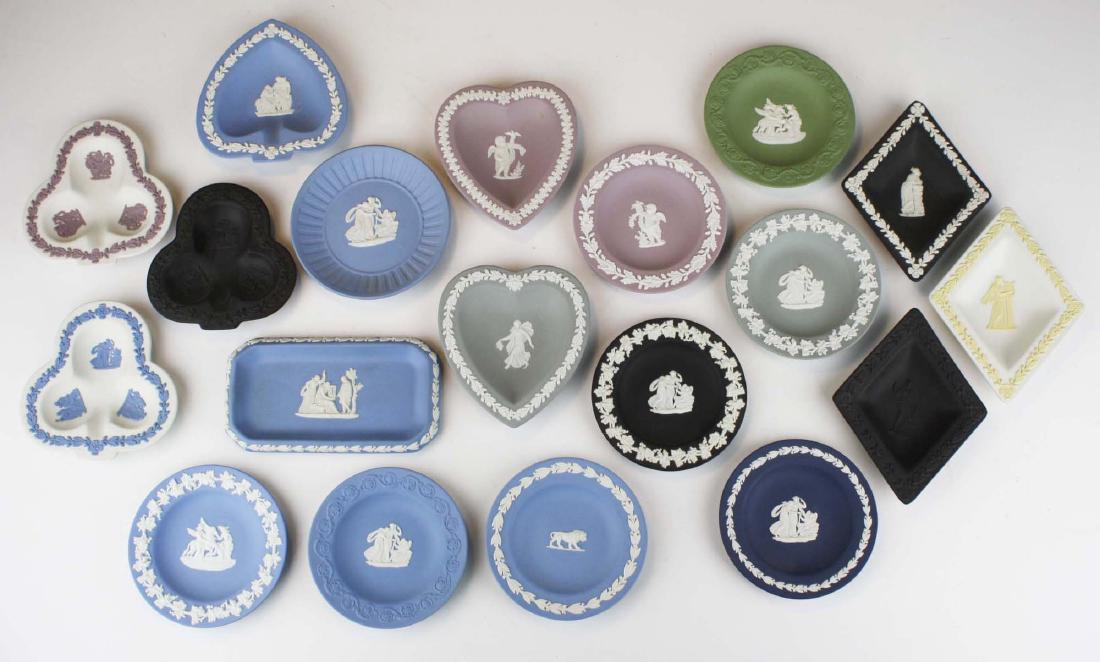 19 Wedgwood Jasperware pottery pin trays, some in: color pairings, including sage green, gray, lilac, black, pale blue and basalt, all having classical figures and decoration in relief