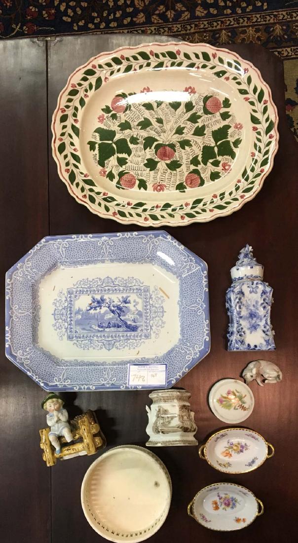 lot of early 19th c. porcelain and late Victorian china: incl. reticulated creamware wine coaster, strawberry soft paste platter, blue transferware platter, pair of Dresden nut dishes, Nymphenburg type cat, Dresden blue and white jar, figural matchsafe, etc