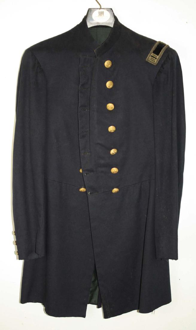 VT Civil War Officers Double Breasted frock coat: US Civil war officer's double breasted frock coat with 14 VT buttons on chest, 3 non functional at each wrist and four in the back and one captain's strap. Coat is in excellent shape but does have som