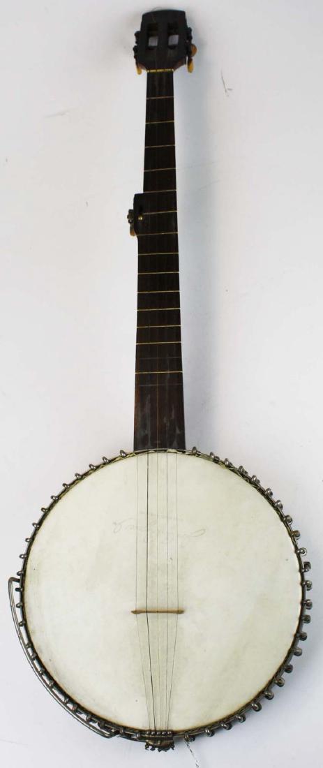 Five string fretless banjo: Late 19th c Five string fretless banjo, slotted headstock with bone tuning keys, fret markers and nut. Tuner straps are engraved with floral device. Unmarked but with Jos. B. Rogers head missing two f