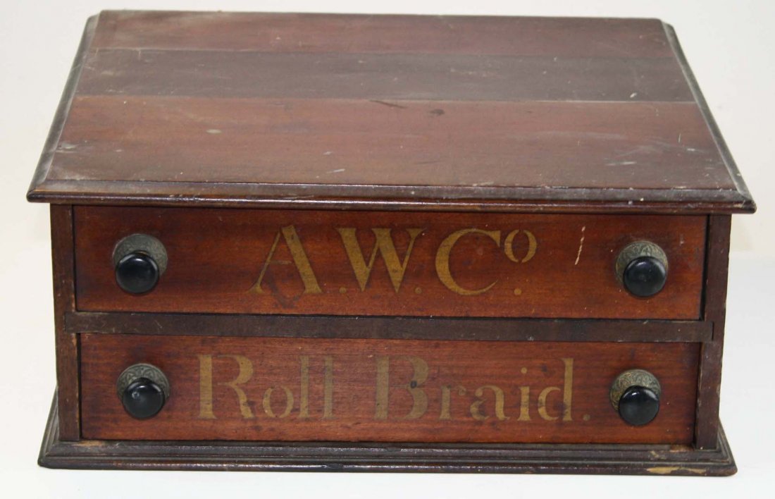 AW Co. "Roll Braid" 2 drawer spool cabinet: AW Co. "Roll Braid" 2 drawer stained hardwood country store mercantile spool cabinet in original finish and gilt stenciled lettering, with ebonized knobs and embossed brasses 7" x 16" x 15"