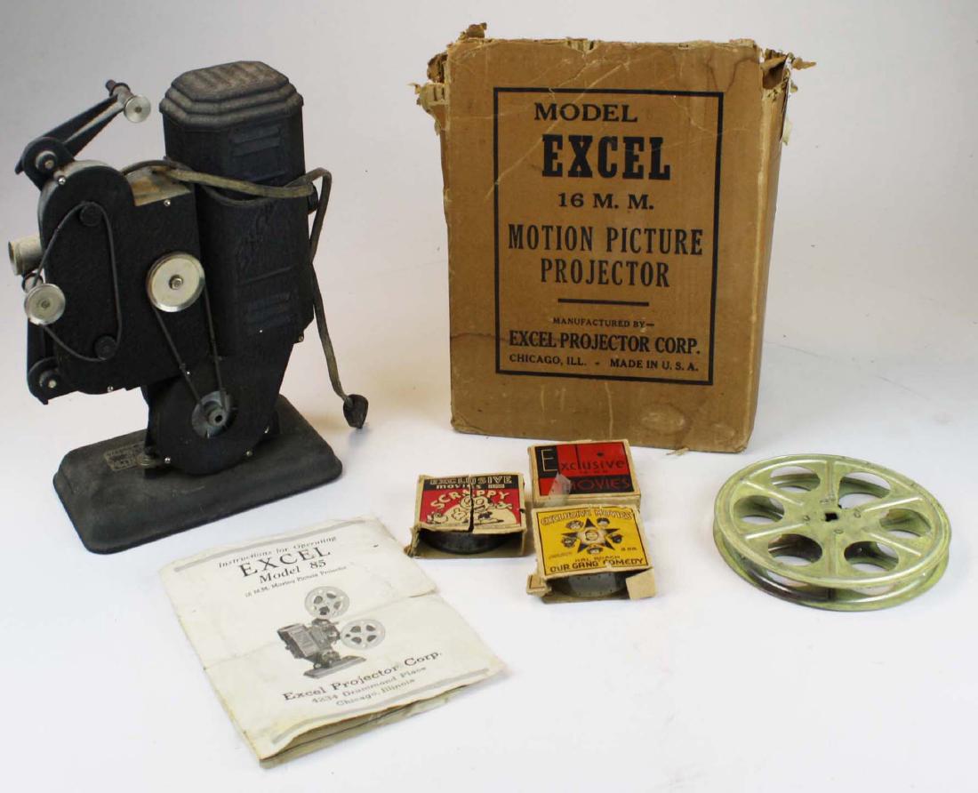 vintage 1940's Excel 13 mm film projector: vintage 1940's Excel 13 mm film projector in original box, with instructions and 3 films incl. "Our Gang Comedy", and "Scrappy" 14" x 10"