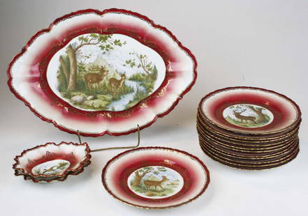 Moritz Zdekauer Austrian porcelain game set: 15 pc. Moritz Zdekauer (1884-1909) Austrian porcelain game set with elk transfer decoration, burgundy gilt border, consisting of 12 plates, two side dishes, and platter