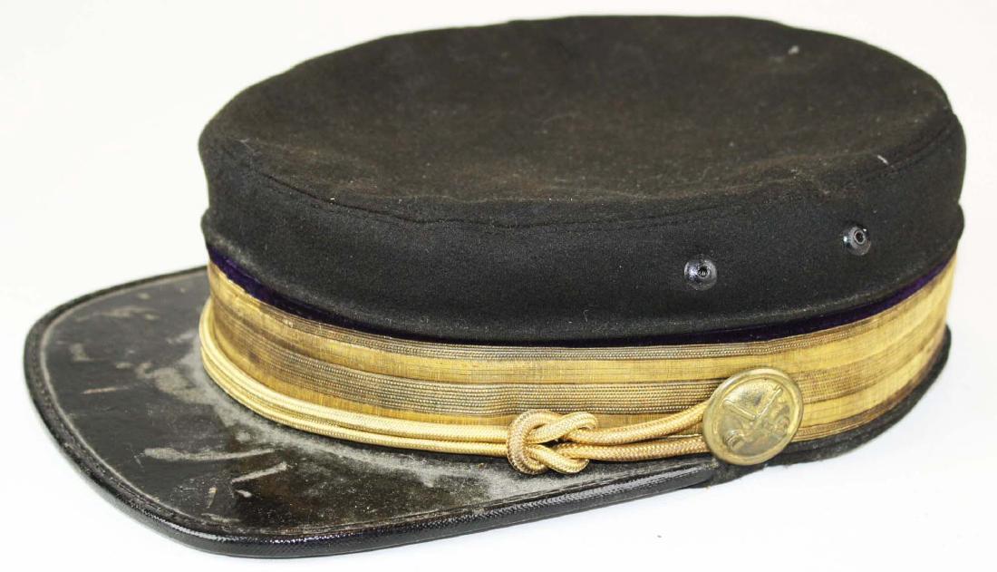 Post Civil War cap with crossed sabre buttons: Unusual Post Civil War Cap with crossed sabre buttons at temple, Oilskin rain cover and original box Raymold and Whitlock NY 1885 label,