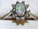 14k white gold, opal, and diamond ladies ring.