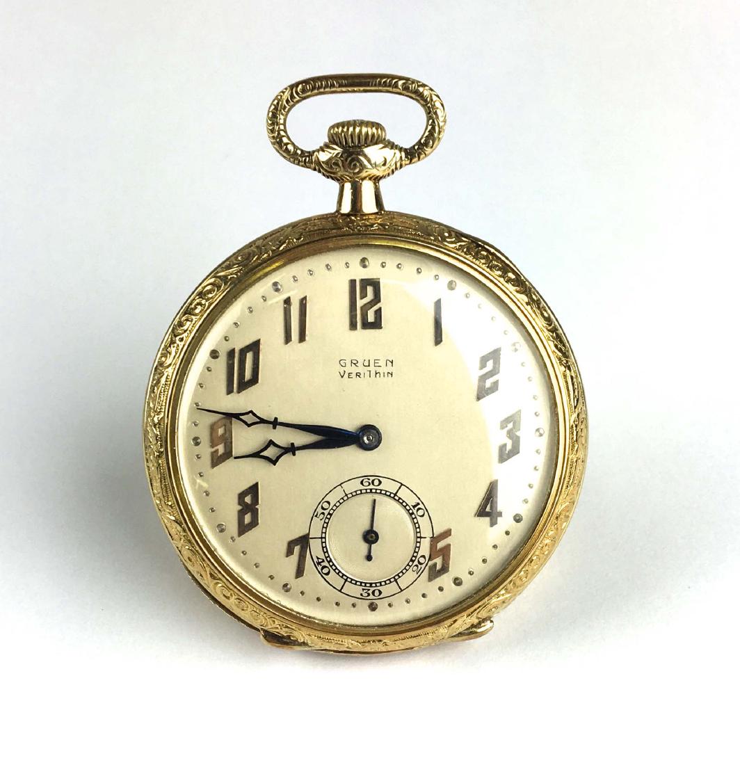Gruen 14k yellow gold open face pocket watch: Gruen Verithin 14k yellow gold open face pocket watch. Arabic numerals. Engraved edge. Working fine condition.